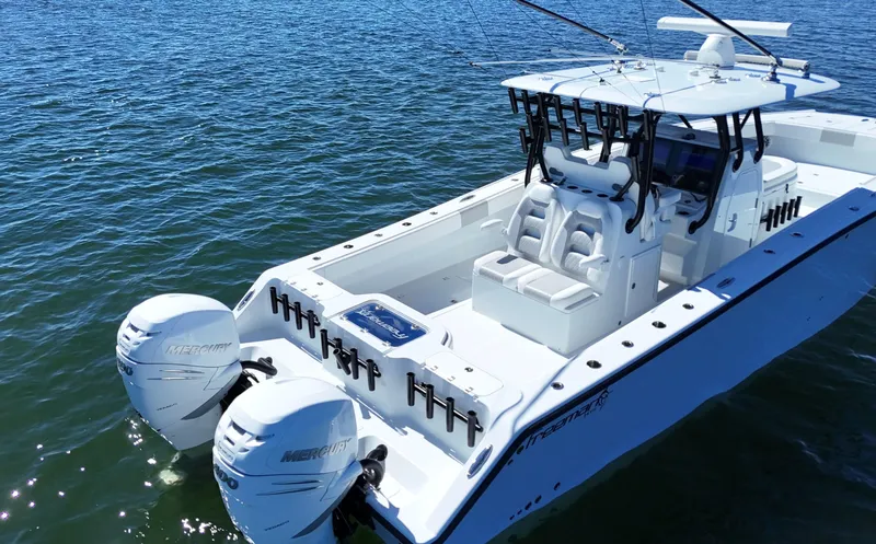 Slide: The Image of 2022 Freeman 34VH boat with dual Mercury engines on open water. - 22