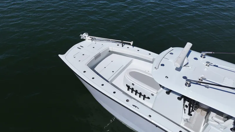 Slide: The Image of Freeman 34VH 2022 boat on water, showcasing sleek design and spacious deck. - 24
