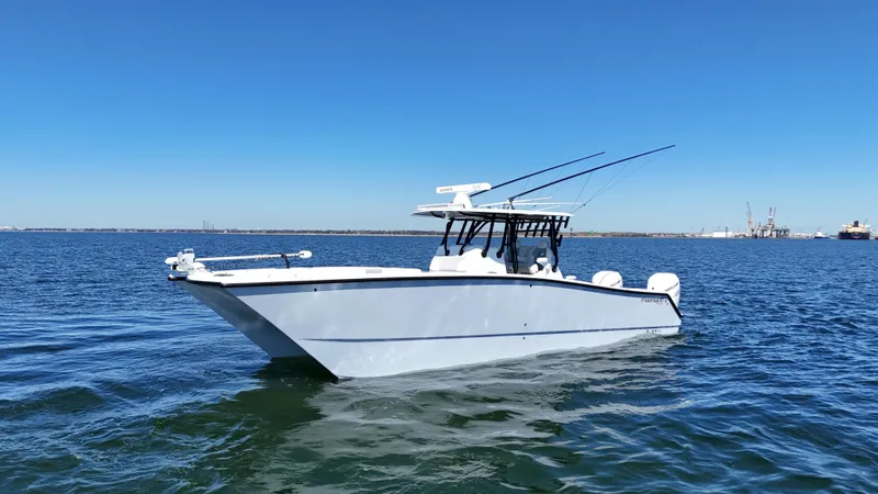 Slide: The Image of Freeman 34VH 2022 boat on open water under clear blue sky. - 3