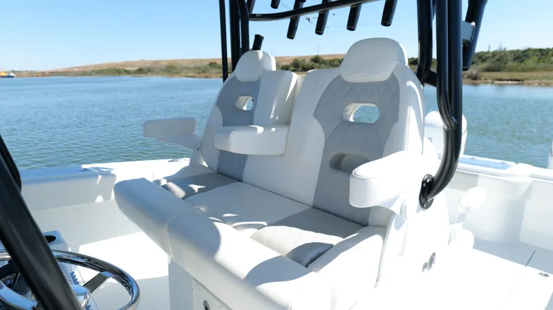 Slide: The Image of Luxury seating on 2022 Freeman 34VH boat, featuring comfortable white cushions and armrests. - 33