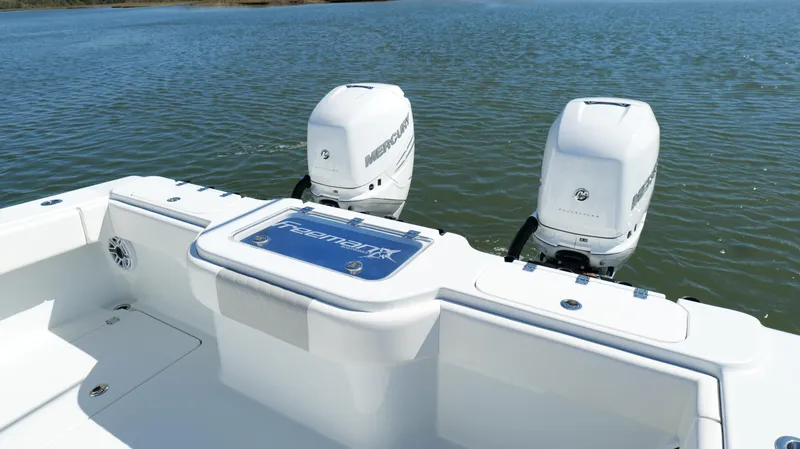 Slide: The Image of 2022 Freeman 34VH boat with dual outboard motors on calm water. - 36