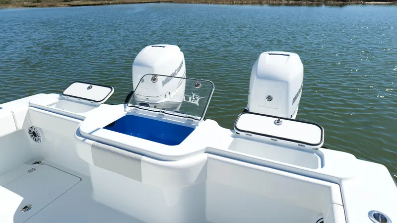 Slide: The Image of 2022 Freeman 34VH boat with dual engines on a calm lake. - 37