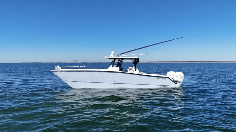 Slide: The Image of Freeman 34VH 2022 boat on open water under clear blue sky. - 4