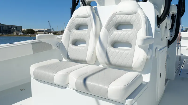 Slide: The Image of Luxury seating on 2022 Freeman 34VH boat, featuring white cushioned seats. - 40