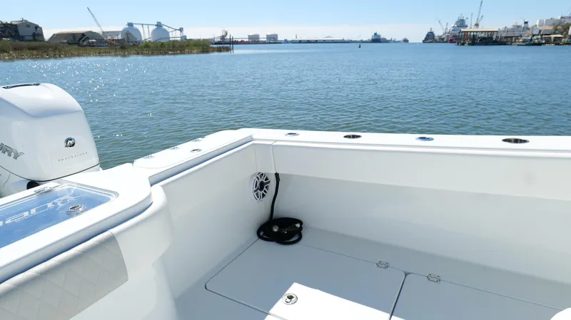 Slide: The Image of Freeman 34VH 2022 boat on calm water, featuring a spacious deck and scenic harbor view. - 42