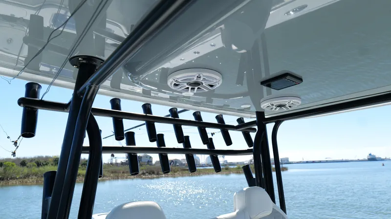 Slide: The Image of Freeman 34VH 2022 boat with rod holders and speakers on a sunny day. - 45