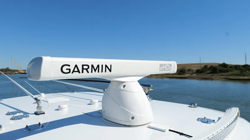 Slide: The Image of Garmin xHD radar on Freeman 34VH boat, 2022 model, against clear blue sky. - 47