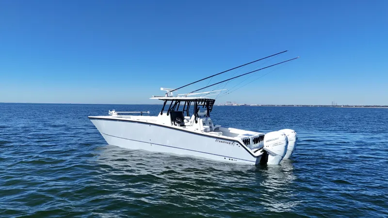 Slide: The Image of Freeman 34VH 2022 boat on open water under clear blue sky. - 5