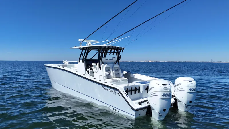 Slide: The Image of 2022 Freeman 34VH boat with dual engines on open water. - 6