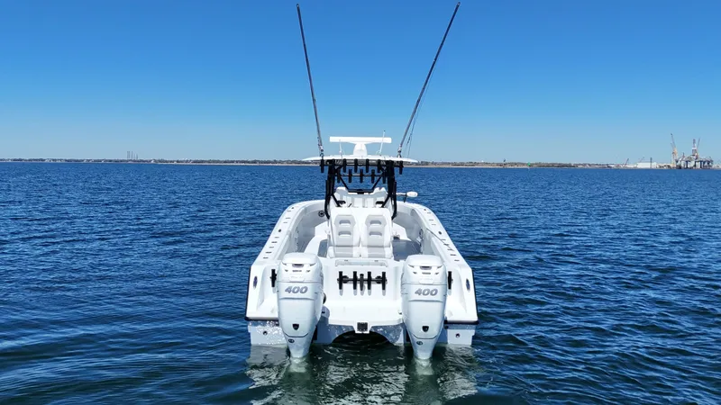 Slide: The Image of 2022 Freeman 34VH boat on open water, featuring dual 400 horsepower engines. - 7