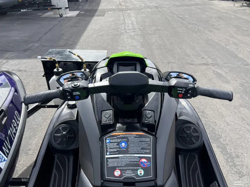 Slide: The Image of 2021 Yamaha WaveRunner GP1800R handlebars and controls, parked on pavement. - 7