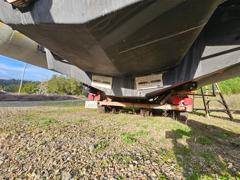 Slide: The Image of Underneath view of a 1996 Eduardono RIB boat on a trailer. - 15