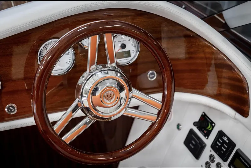 Slide: The Image of Steering wheel of 2025 Comitti Venezia V28, featuring elegant wood and chrome detailing. - 19