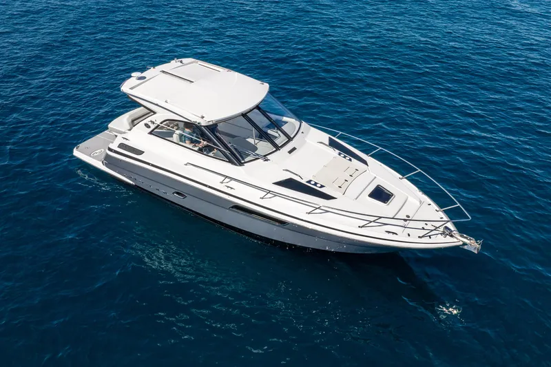 Slide: The Image of 2020 Regal 35 Sport Coupe cruising on clear blue water. - 1