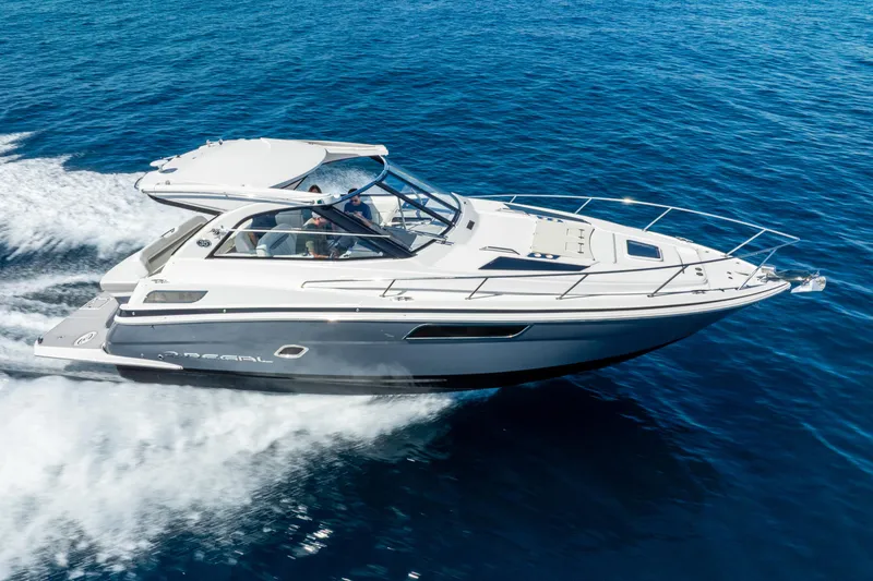 Slide: The Image of 2020 Regal 35 Sport Coupe cruising on open blue water. - 11