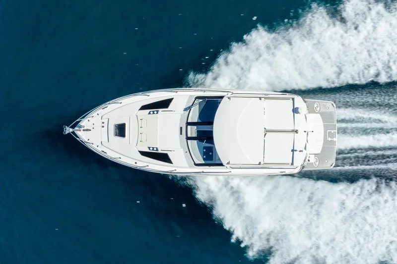 Slide: The Image of Aerial view of 2020 Regal 35 Sport Coupe cruising on blue water. - 16