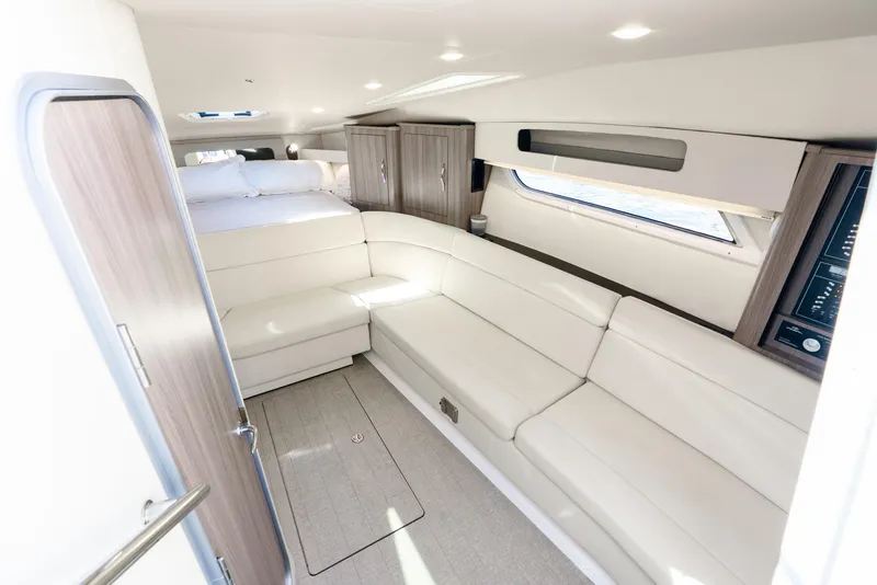 Slide: The Image of 2020 Regal 35 Sport Coupe interior with white seating and modern design. - 18