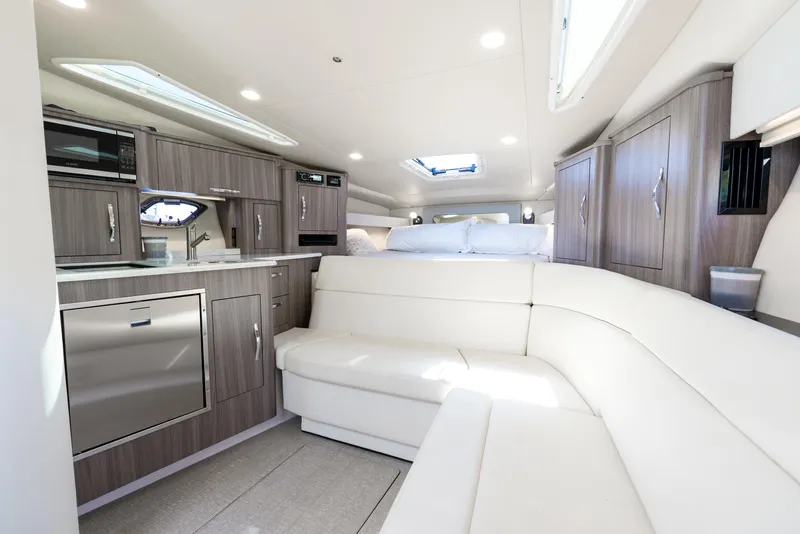 Slide: The Image of Luxurious interior of 2020 Regal 35 Sport Coupe with modern kitchen and seating. - 19