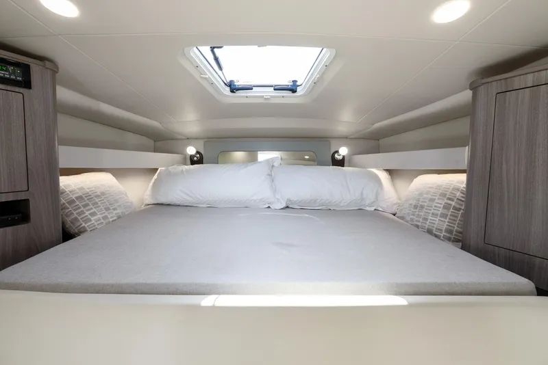 Slide: The Image of 2020 Regal 35 Sport Coupe interior cabin with bed and skylight. - 24