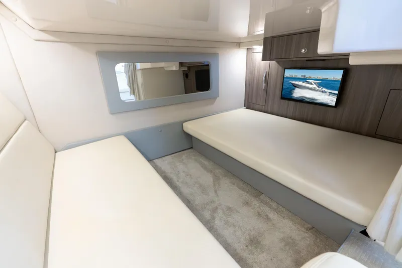 Slide: The Image of Interior of 2020 Regal 35 Sport Coupe with modern seating and wall-mounted TV. - 29