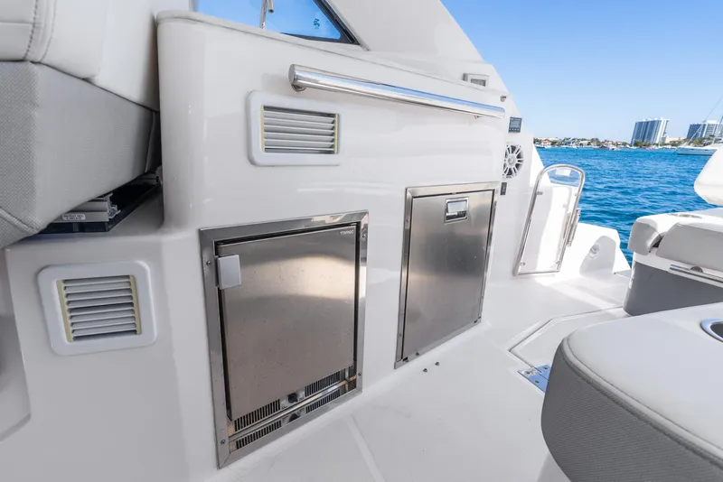 Slide: The Image of 2020 Regal 35 Sport Coupe yacht interior with stainless steel appliances and ocean view. - 31