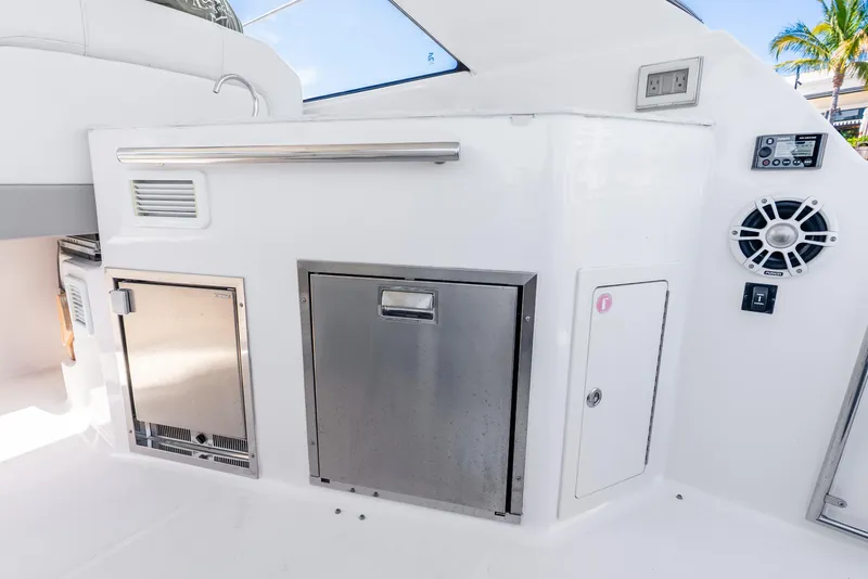 Slide: The Image of 2020 Regal 35 Sport Coupe yacht interior with stainless steel appliances and modern design. - 36