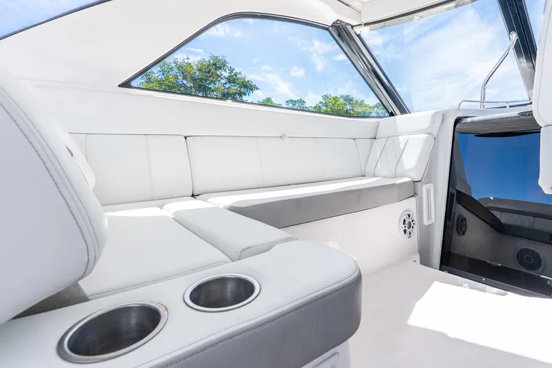 Slide: The Image of 2020 Regal 35 Sport Coupe interior with white seating and cup holders. - 37