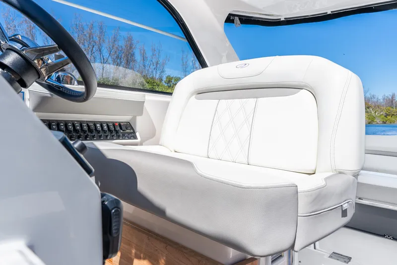 Slide: The Image of 2020 Regal 35 Sport Coupe interior with white leather seating and control panel. - 39