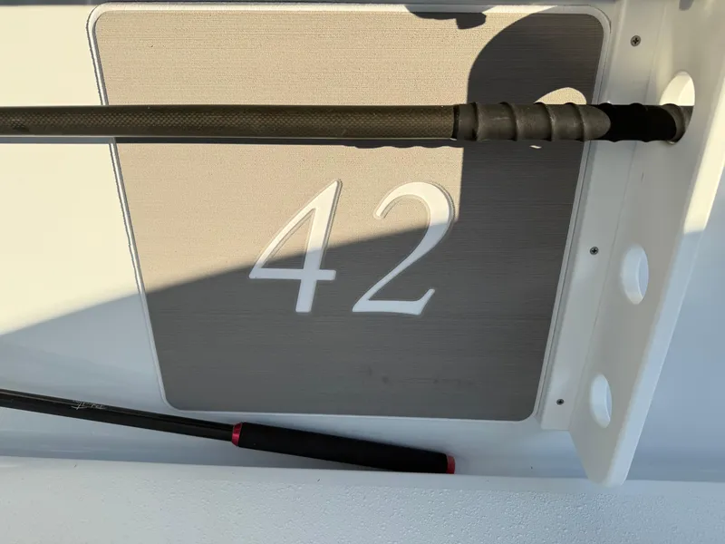 Slide: The Image of 2025 Yellowfin 42 CC boat detail with fishing rod holders. - 25