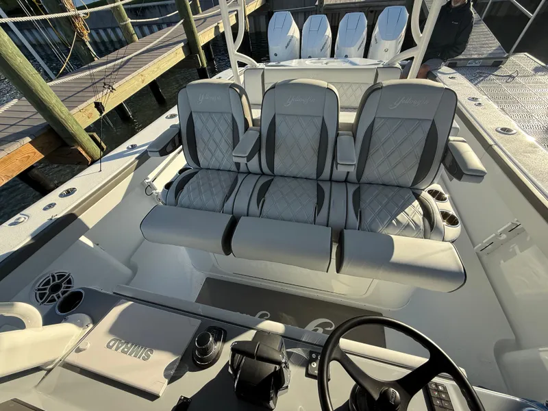 Slide: The Image of 2025 Yellowfin 42 CC boat interior with luxurious seating and modern controls. - 28