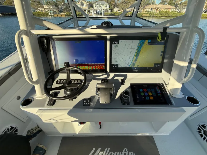 Slide: The Image of 2025 Yellowfin 42 CC boat dashboard with advanced navigation and control systems. - 31