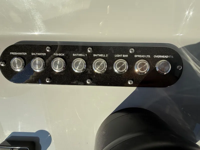 Slide: The Image of Control panel of 2025 Yellowfin 42 CC boat with labeled switches. - 41