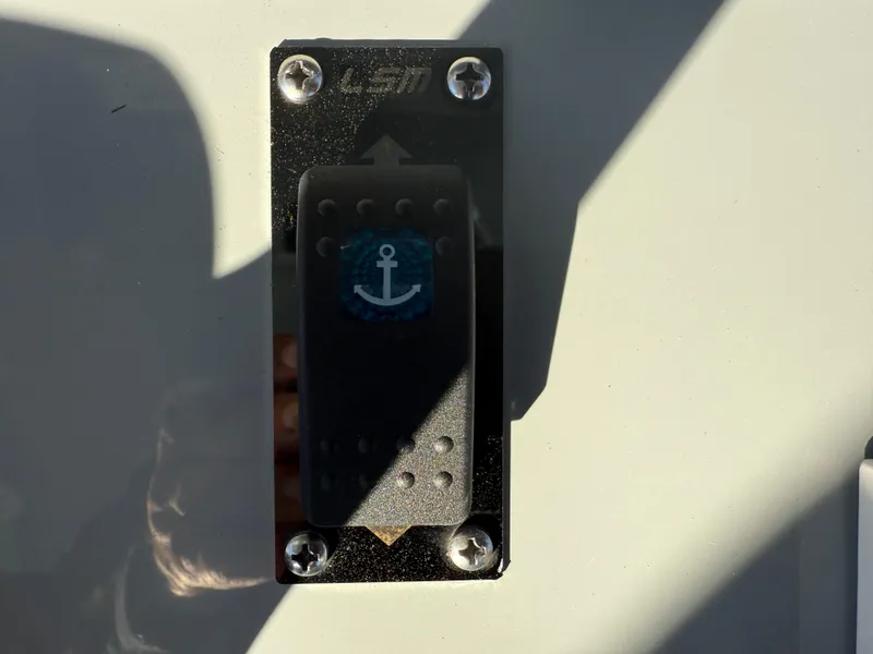 Slide: The Image of Switch with anchor symbol on 2025 Yellowfin 42 CC boat. - 43