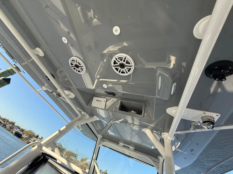 Slide: The Image of 2025 Yellowfin 42 CC boat interior with speakers and storage compartments. - 44