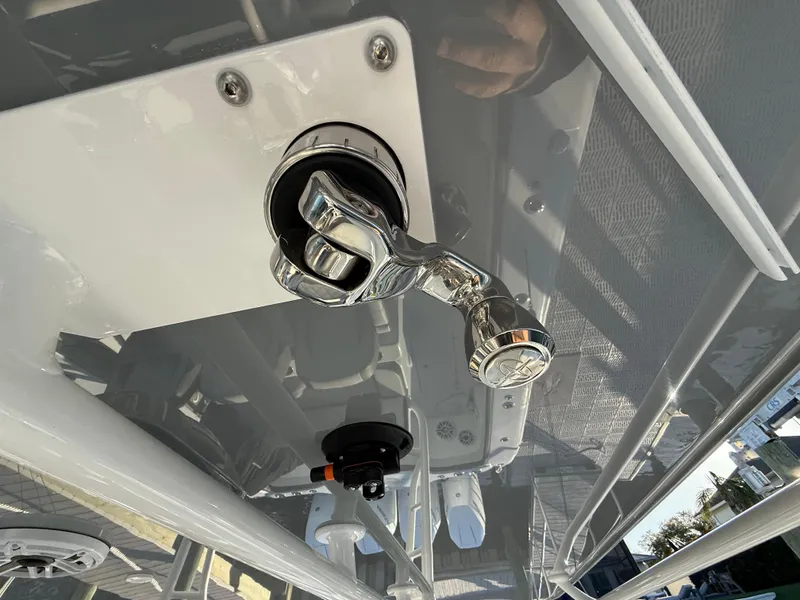 Slide: The Image of 2025 Yellowfin 42 CC boat hardware detail, featuring a chrome latch and fittings. - 45