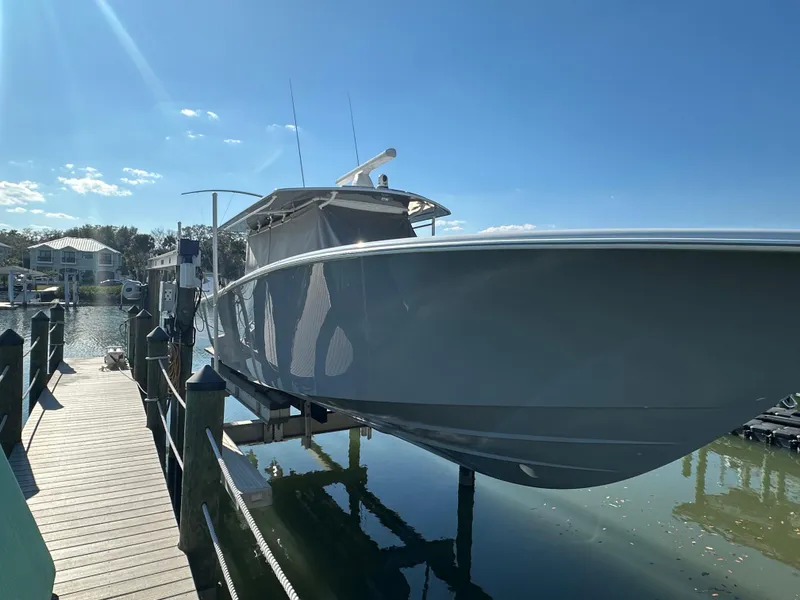 Slide: The Image of 2025 Yellowfin 42 CC boat docked on a sunny day. - 7