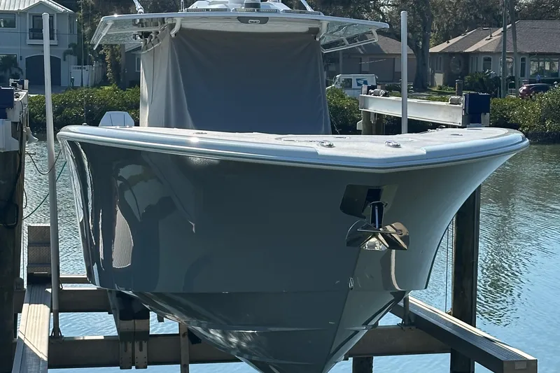 Slide: The Image of 2025 Yellowfin 42 CC boat docked, showcasing sleek design and modern features. - 8