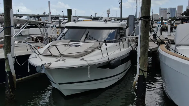 Slide: The Image of 2017 Jeanneau NC 11 boat docked at marina, front view. - 0