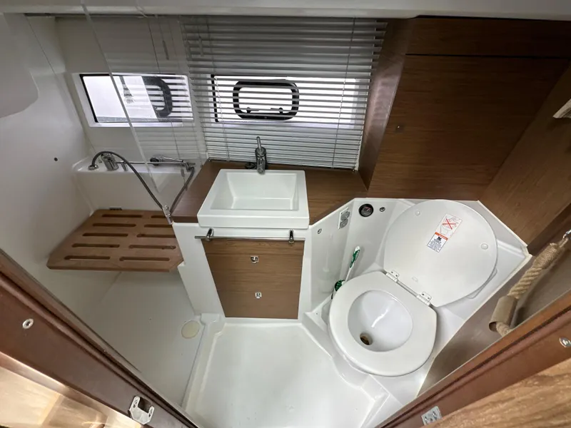Slide: The Image of Bathroom interior of 2017 Jeanneau NC 11 boat with sink and toilet. - 14