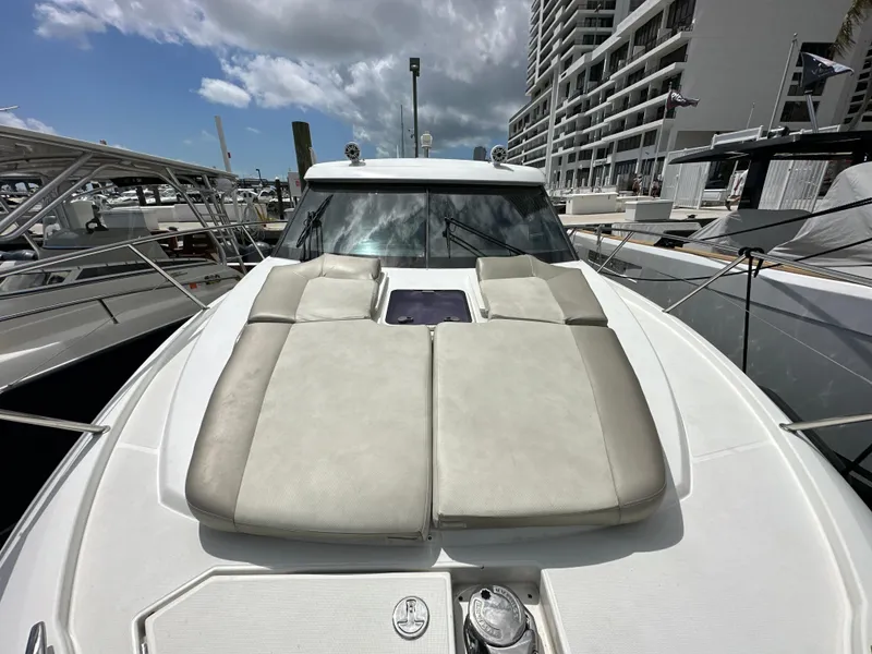 Slide: The Image of 2017 Jeanneau NC 11 yacht with sunbathing cushions docked at marina. - 29