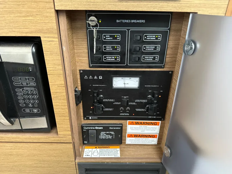 Slide: The Image of Electrical panel of 2017 Jeanneau NC 11 boat with battery breakers and controls. - 37