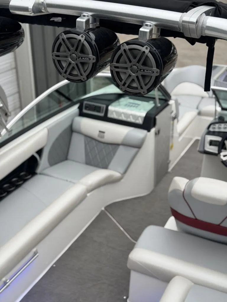 Slide: The Image of 2015 MasterCraft X46 boat interior with JL Audio speakers and luxurious seating. - 19