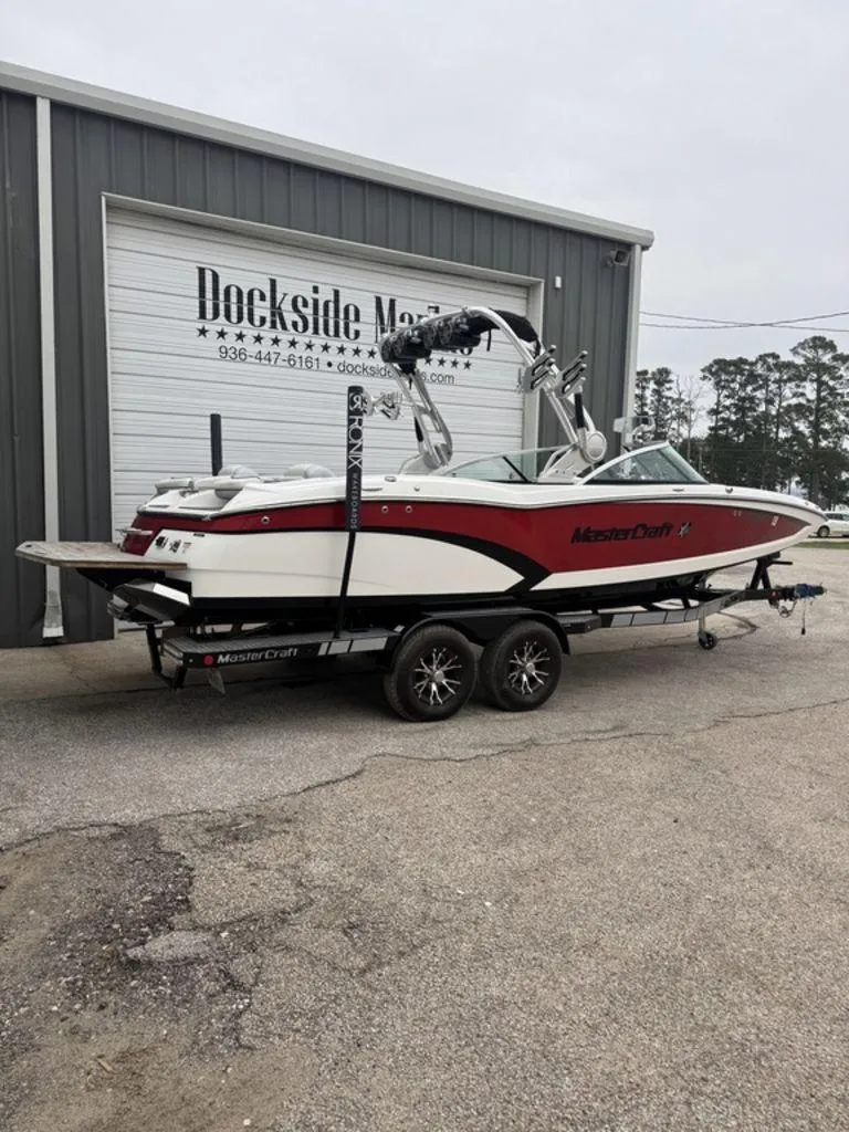 Slide: The Image of 2015 MasterCraft X46 boat on trailer outside Dockside Marine building. - 21