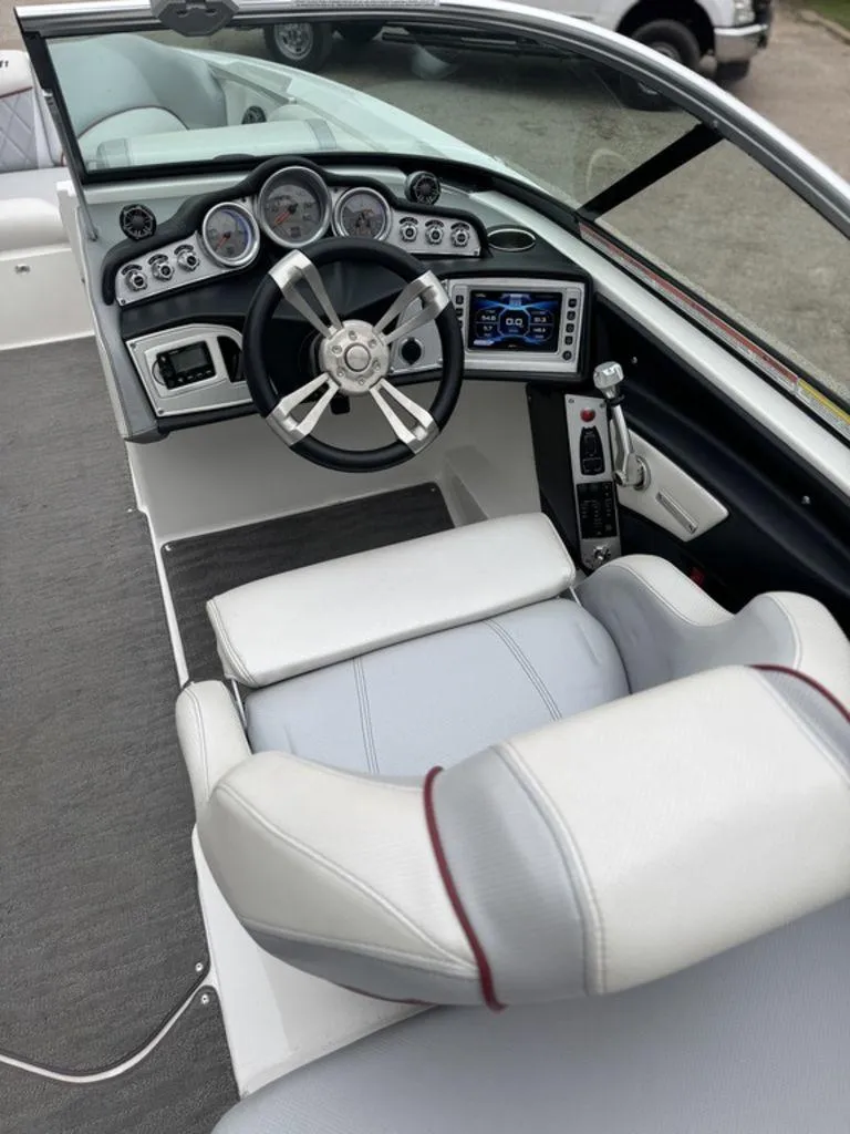 Slide: The Image of 2015 MasterCraft X46 boat cockpit with modern steering and dashboard controls. - 6