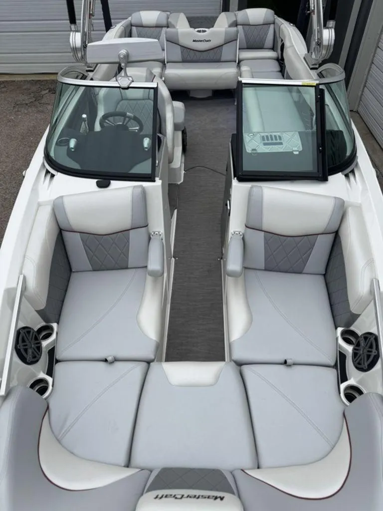 Slide: The Image of 2015 MasterCraft X46 boat interior with gray seating and modern design. - 8