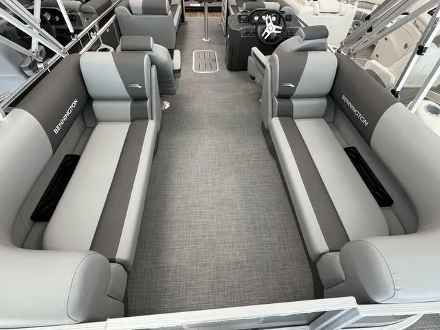 Slide: The Image of 2025 Bennington S Quad Bench 22 SSR interior with gray seating and modern design. - 5