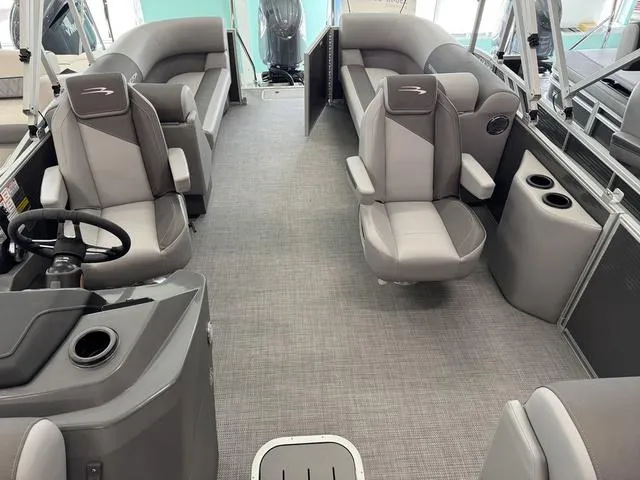 Slide: The Image of 2025 Bennington S Quad Bench 22 SSR interior with gray seating and modern design. - 7