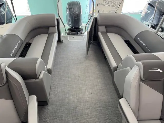 Slide: The Image of 2025 Bennington S Quad Bench 22 SSR interior with gray seating and modern design. - 8