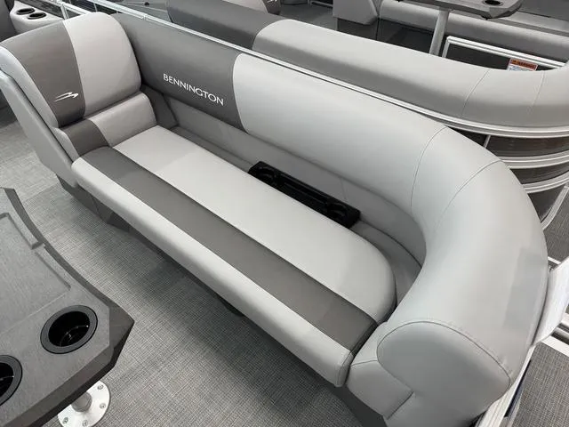 Slide: The Image of 2025 Bennington S Quad Bench 22 SSR with sleek gray seating and cup holders. - 9