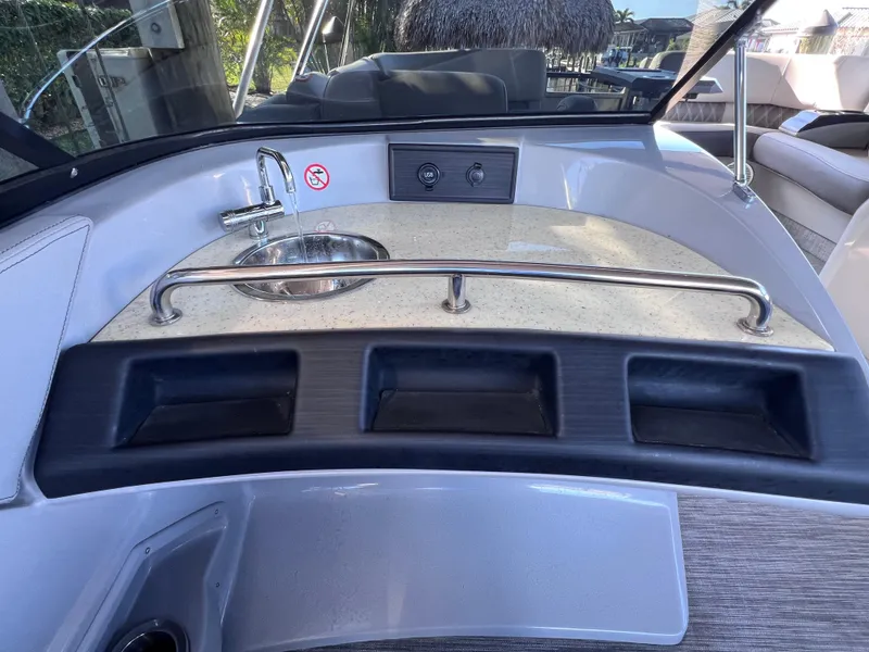 Slide: The Image of Interior view of 2021 Bennington QX 27 boat with sink and countertop. - 21
